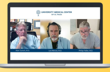Médicos participando en un panel virtual a través de una computadora portátil, representando la cumbre de trauma de UMC y la colaboración médica regional.